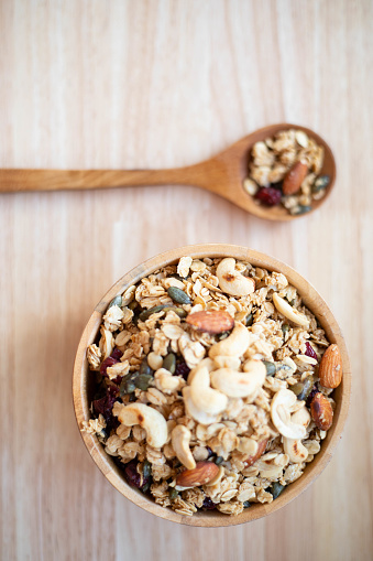 Various cereals and granola mix in a bowl