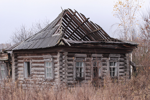 Old destroyed wooden house in the village