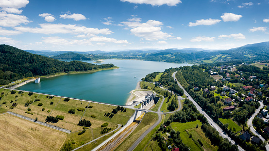 Vacations in Poland - view from the drone of  Lake Mucharskie with water dam on the Skawa river in Beskidy Mountains, Swinna Poreba in Malopolska province