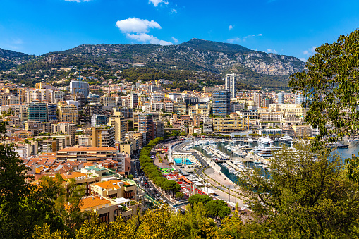 Monaco, France - August 2, 2022: Panoramic view of Monaco metropolitan area with Hercules Port, Carrieres Malbousquet and Les Revoires quarters at Mediterranean Sea coast