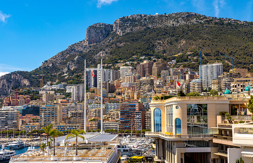 Monaco, France - August 2, 2022: Panoramic view of Monaco metropolitan area with Monte Carlo, Carrieres Malbousquet and Les Revoires quarters over Hercules Port at French Riviera coast