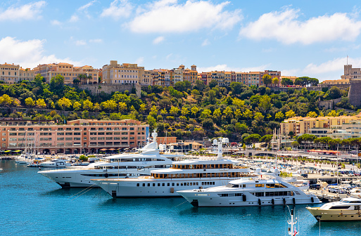 Monaco, France - August 2, 2022: Panoramic view of Hercules Port and yacht marina with Monaco Ville Rock quarter at French Riviera coast in Monte Carlo district of Monaco Principate