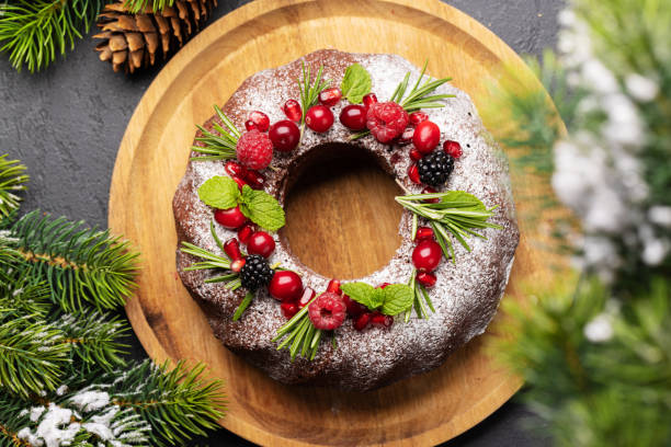 istock Christmas cake with pomegranate seeds, cranberries and rosemary 1441617196