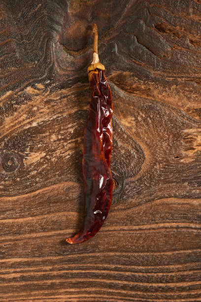 Dried green Pepper on Wooden background.