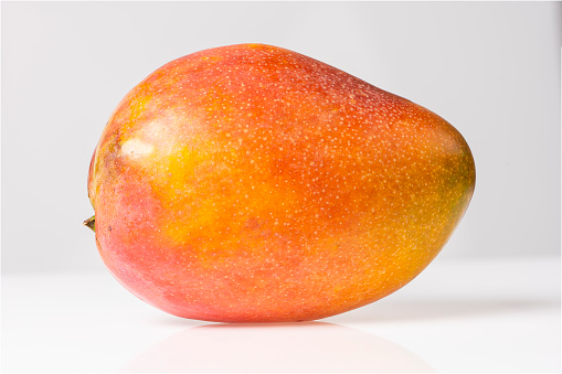 Mango slice on white background.