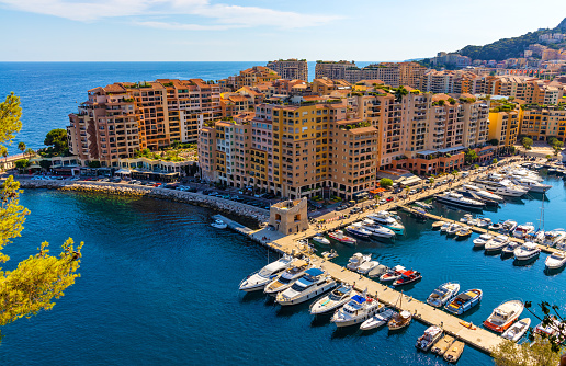 Monaco, France - August 2, 2022: Panoramic view of Monaco metropolitan area with Port Fontvielle yacht marina with surrounding residences at Mediterranean Sea coast