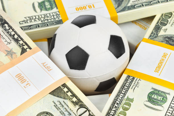 istock Money and soccer ball 1441619504