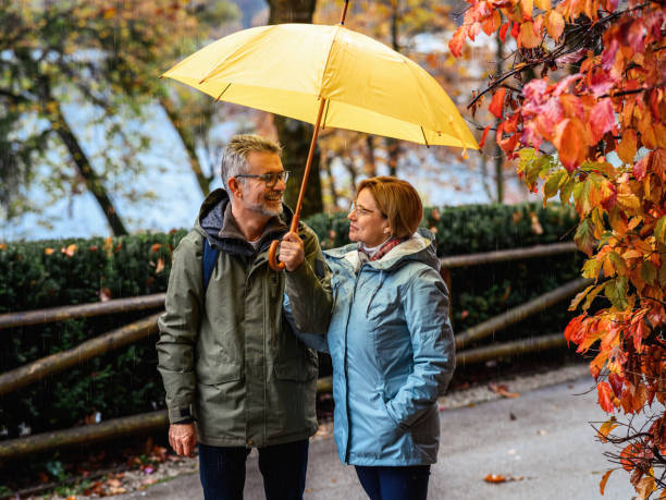 istock Mature couple enjoying a rainy day 1441621009