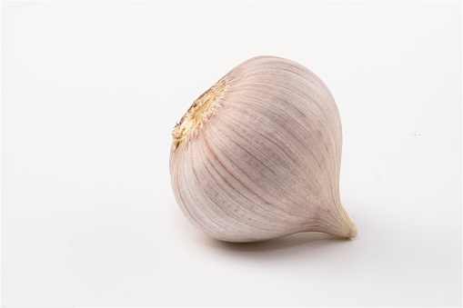 Raw white garlic with white background.