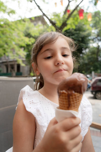 istock Kids eating ice-cream 1441621184