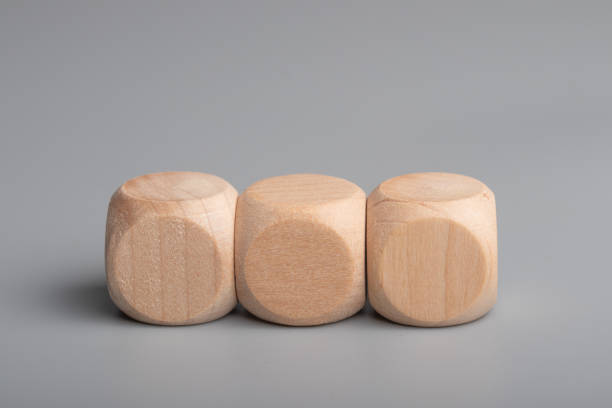 istock Empty wooden dice stacked on gray background 1441628343