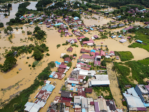 Aerial view of Situation Flood in . Floods hit homes and highways, disrupting transportation,  floods because high rainfall. Location east kutai, east Kalimantan, Indonesia