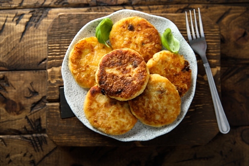 Homemade savory potato pancakes with fresh basil