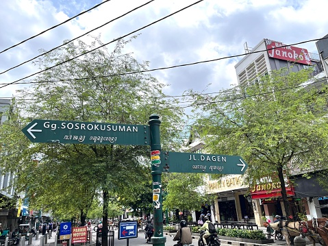 Yogyakarta, Indonesia -  November 12, 2022: a road sign around the street of Malioboro which is the most famous landmark in Yogyakarta, Indonesia.