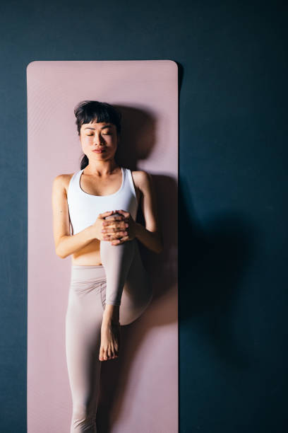 istock High Angle View Of Beautiful Woman Doing Warm Up Exercise 1441634700
