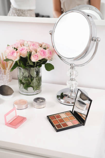 istock Cosmetics for make-up, mirror and brushes, eyes shadow with foundation 1441636181