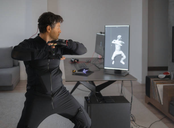 istock A Caucasian guy is creating a 3d animation by using a mock-up smart suit. 1441639176