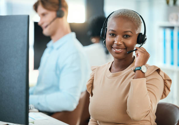 istock Call center, customer service  and support consultant working in a busy office, friendly help with happy woman. Portrait of relax female consulting with online client, enjoying career and workplace 1441643140