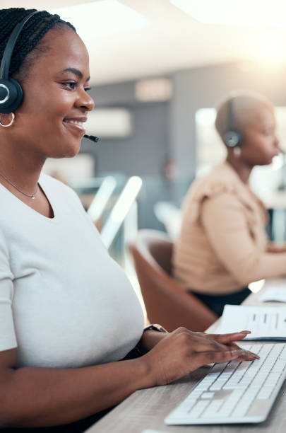 black woman, call center and contact us teamwork in office for crm consulting, help or customer support. happy smile receptionist, telemarketing consultant or sales women working in b2b communication - hotel reception customer service representative headset receptionist imagens e fotografias de stock