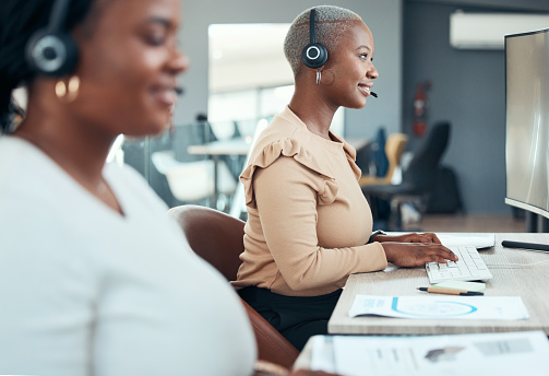 Customer service, call center and telemarketing consultant happy to help with friendly quality support. Black woman working as an insurance agent talking to a client for a communications company