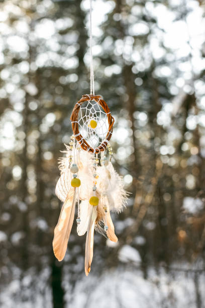 istock Handmade colorfull dream catcher in the snowy forest 1441643562