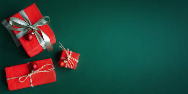 istock Banner with Christmas gift and decorations on green background. 1441647073