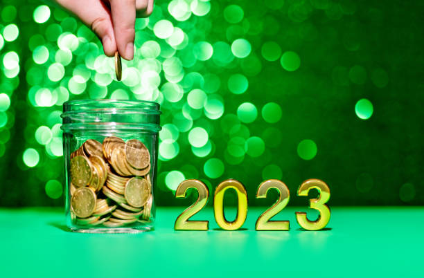 istock 2023 new year and coin jar on the table 1441650744