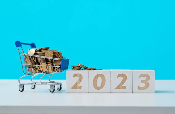 istock Shopping cart and number 2023 on the table 1441651471