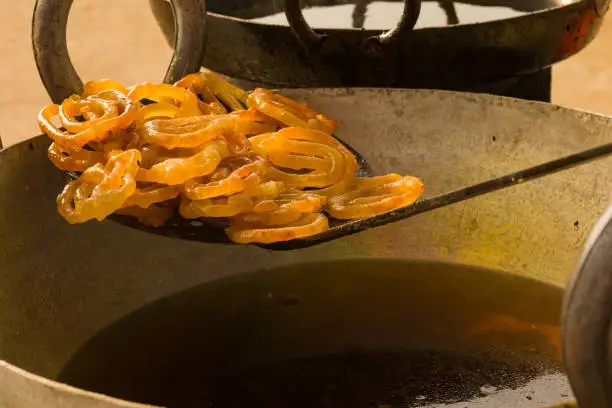 Photo of jalebi or jilipi freshly prepared. traditional indian dessert prepared during ratha yatra.