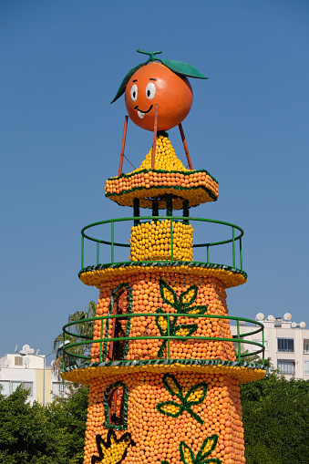 Mersin, Turkey - November 13, 2022: Lighthouse model made of citrus fruits on display at Mersin Citrus Festival, an annual festival held in Mersin, Turkey.
