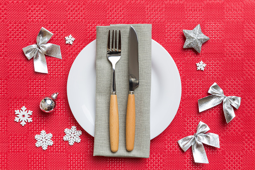 Christmas dinner background with rustic decorations and kitchen utensil . View from above