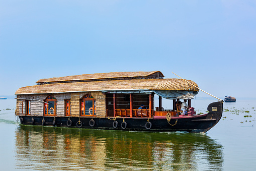 Kerala, India - February 23, 2013: Houseboat on Kerala backwaters. Kerala backwaters are both major tourist attraction and integral part of local people life in Kerala