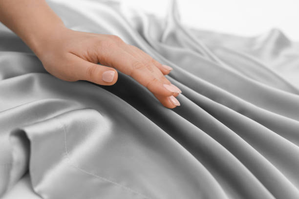 istock Woman touching smooth silky fabric, closeup view 1441660543