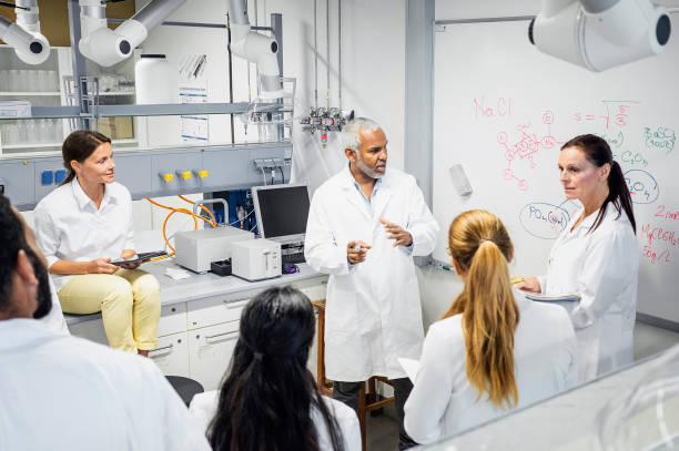 Scientists having a meeting stock photo