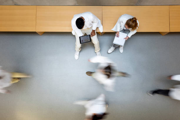 scientists walking in the corridor - department of health and human services imagens e fotografias de stock