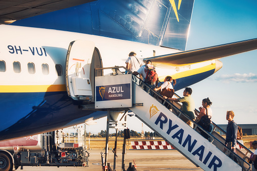 Valencia, Spain - Sept 15 2020: Passengers boarding a Ryanair budget airline flight through the rear door