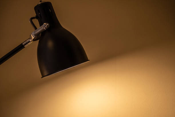 istock Black fixture lamp with white  wall background 1441668240
