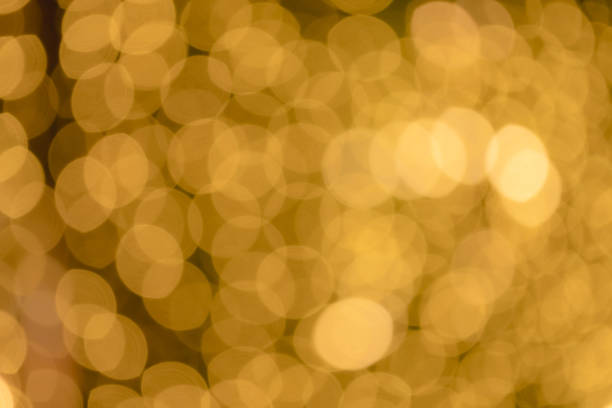 istock Blurred Abstract Golden Bokeh Shapes For Different Backgrounds. Abstract gold bokeh with light, Christmas and new year theme background. 1441668264