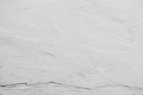 istock The cement wall background abstract gray concrete texture for interior design, The white concrete stone. concrete plastered stucco wall painted. white grunge cement or concrete painted wall texture. 1441668299