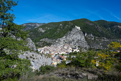 Picturesque landscape of the Alpes-de-Haute-Provence mountains with the town of Entrevaux at the bottom of the valley