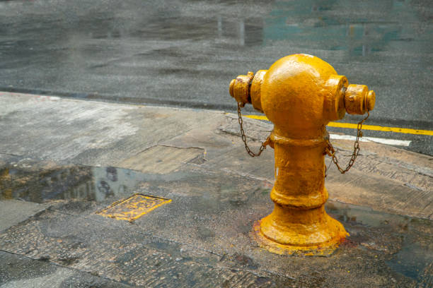 istock Yellow fire with a stone wall background on the street. Copy space for your text. 1441669664