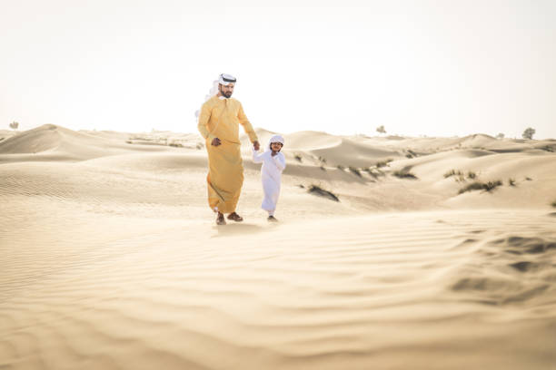 Emirati People Walking Stock Photos, Pictures & Royalty-Free Images ...
