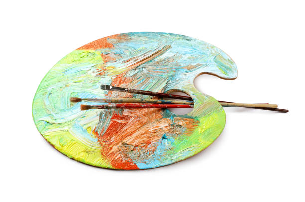 istock Artist's palette with mixed paints and brushes isolated on white 1441671180