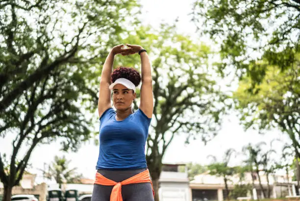 Photo of Portrait of a young woman stretching on a square