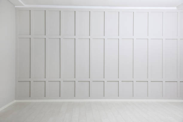 istock Empty spacious room with white wooden floor and walls 1441675396