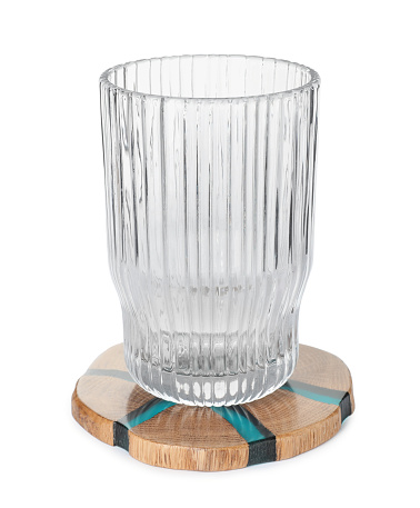 Stylish wooden cup coaster and glass on white background