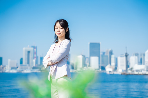 Female businessperson standing with arms crossed
