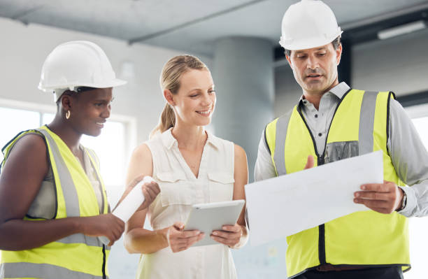 istock Engineer, diversity and planning building strategy with team in meeting with document and digital tablet. Teamwork, collaboration or support with architect employee consulting on architecture design 1441678458