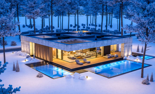 3d rendering of new concrete house in modern style in winter night stock photo