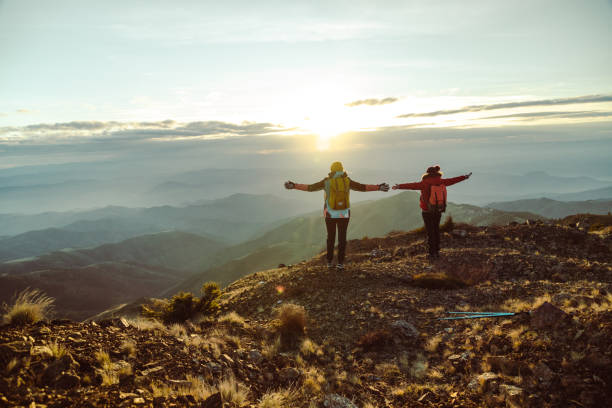 istock Female hikers enjoying the view from mountain peak 1441679504